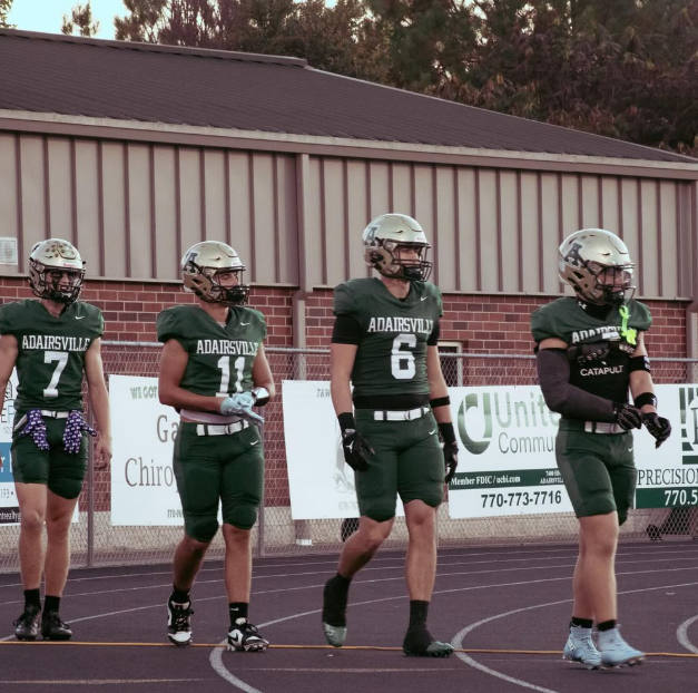 Football team huddle from above